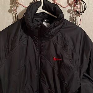 Nike coat XL size. Used but well taken care of. Has a zipper hood in collar.